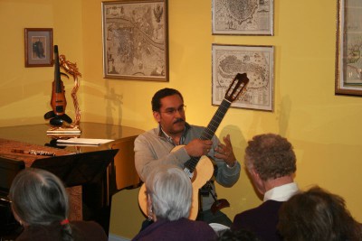 Gerry Saulter performs on guitar at the Fourth Friday Studio Series